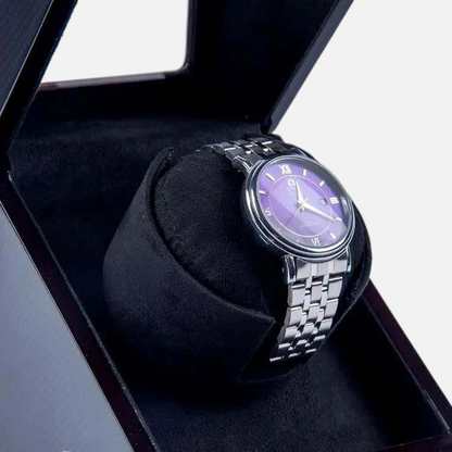 Clairly Onyx 1-slot automatic watch winder with a sleek black finish holding a silver watch with a purple dial
