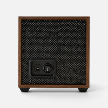Back view of the Clairly Heritage 1-slot watch winder featuring a solid wood frame, black mesh panel, and power port.