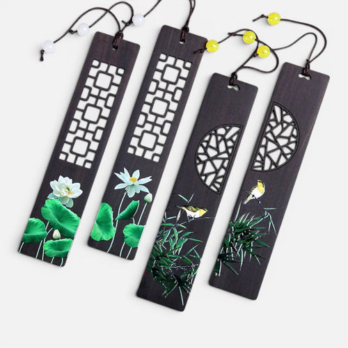 Clairly set of four dark wood bookmarks featuring intricate fretwork, hand-painted lotus flowers, and birds on bamboo.