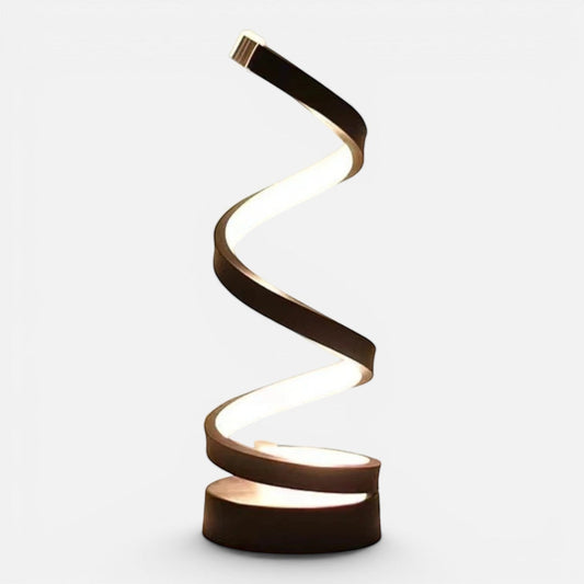 Clairly modern spiral bedside lamp with a black aluminium frame and adjustable LED glow on a wooden nightstand.