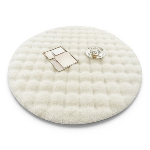 Clairly round white shaggy floor rug with a plush quilted texture and anti-slip backing for home comfort.