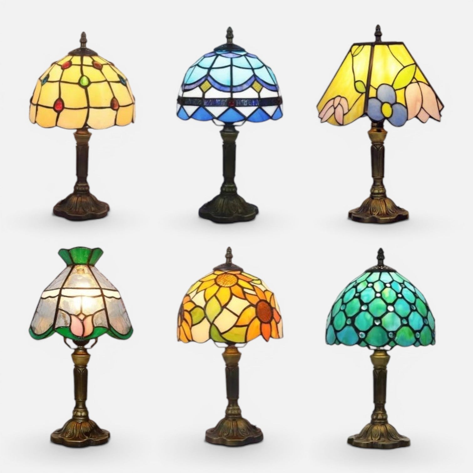 Clairly vintage mosaic stained glass table lamps with antique bronze bases in various floral and geometric patterns.