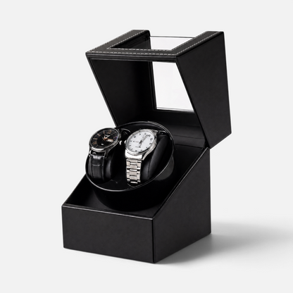 Clairly Portman 2-slot automatic watch winder in black with a magnetic glass lid holding two luxury wristwatches.