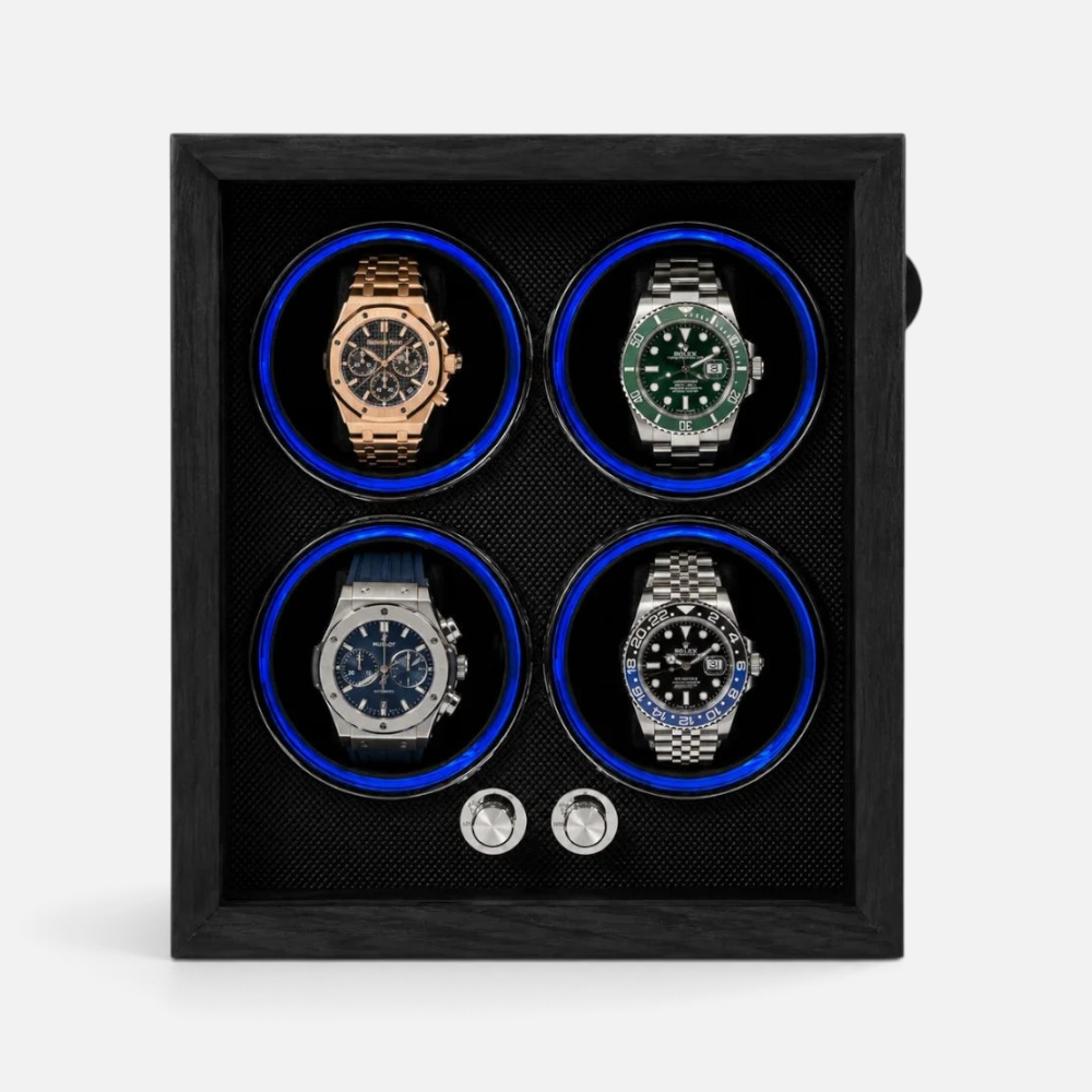 Clairly Midnight 4-slot automatic watch winder in black wood with blue ambient lighting and smoked glass front